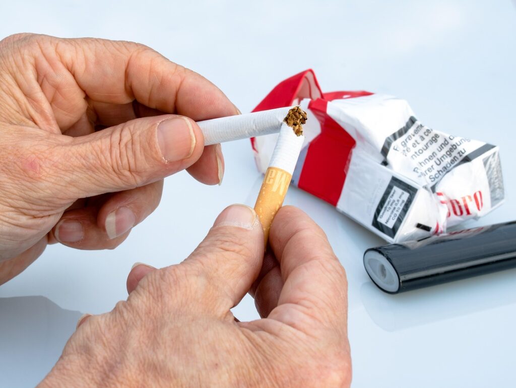 non-smoker, cigarette, hands, cigarette between fingers, cigarette überbrechen, over a broken cigarette, tobacco, crumpled cigarette box, text on box, lighter, highly addictive, seeks, unhealthy, nicotine, lung cancer, stop, cigarette, cigarette, cigarette, cigarette, cigarette, tobacco, tobacco, nicotine